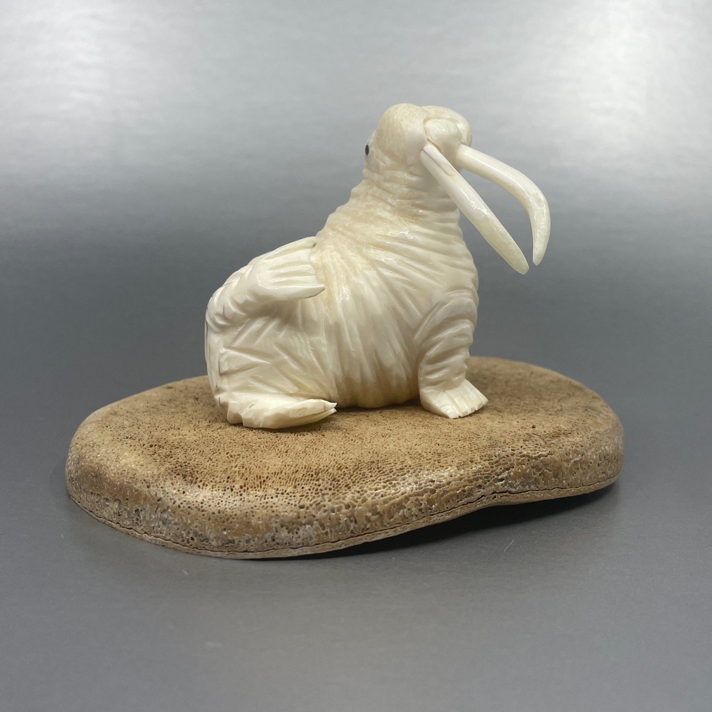 Ivory - D. Pungowiyi; Ivory Walrus on Whalebone Base