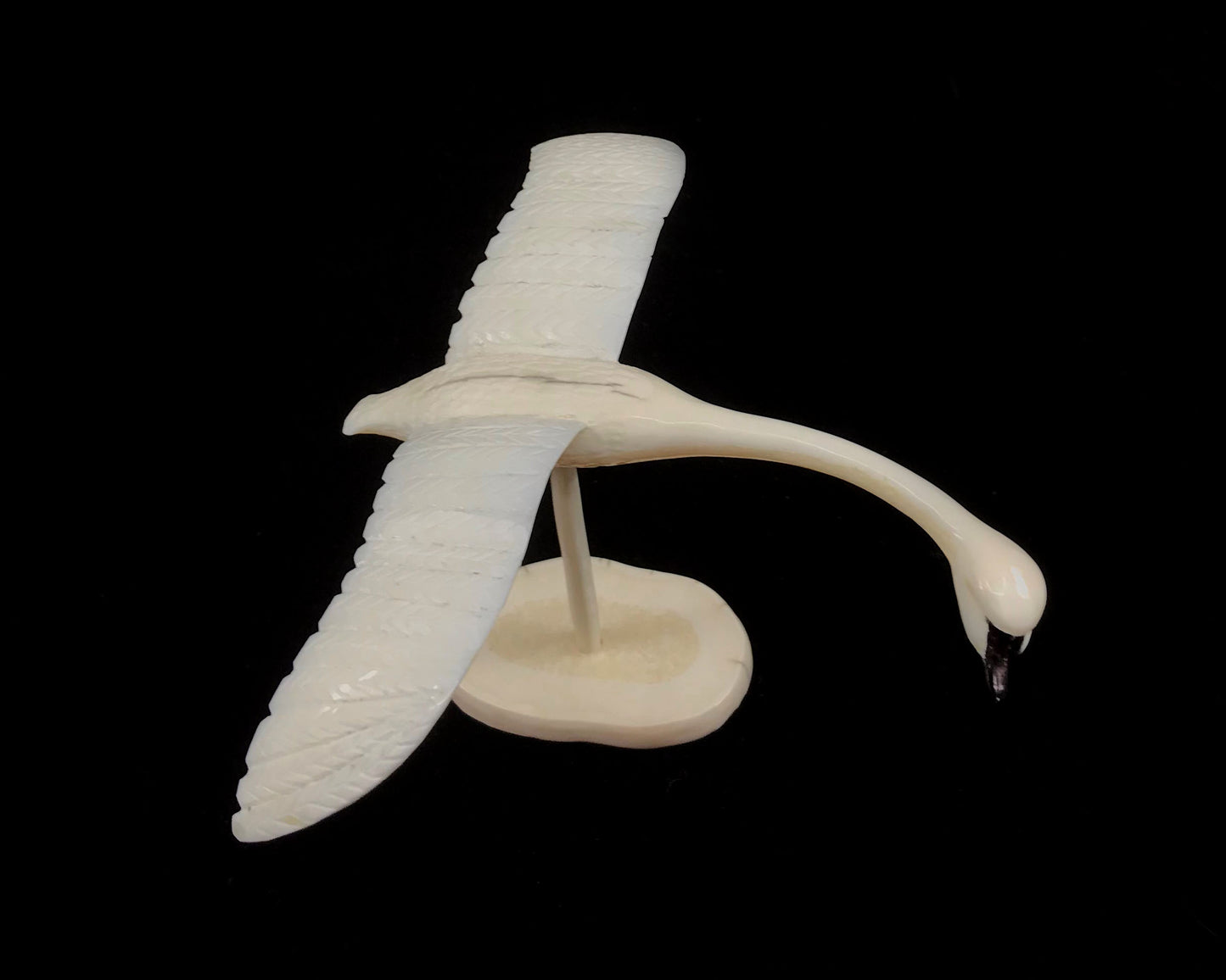 Ivory- L. Penayah: Flying Swan, on Spindle & Tusk Slice Base